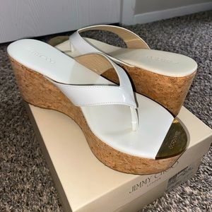 Jimmy Choo white flip flop wedges with gold toe accent